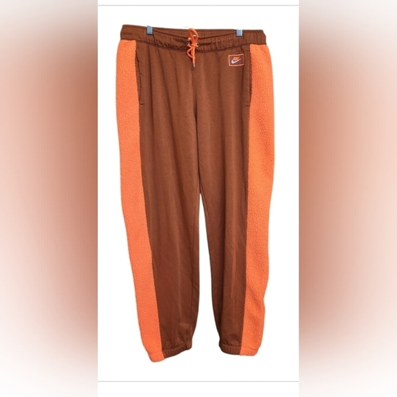 Nike Women's Icon Clash Fleece Joggers Orange Brown Large - Picture 1 of 8